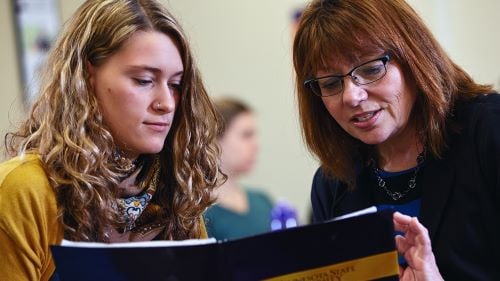 Female instructor advising a female student